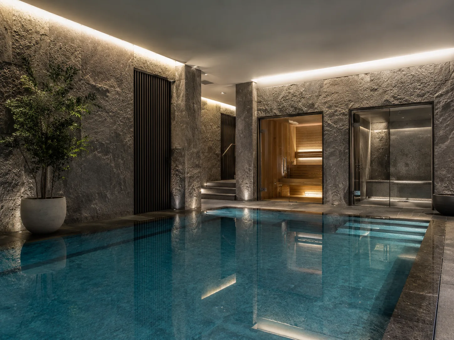 Indoor swimming pool with adjacent sauna and steam room