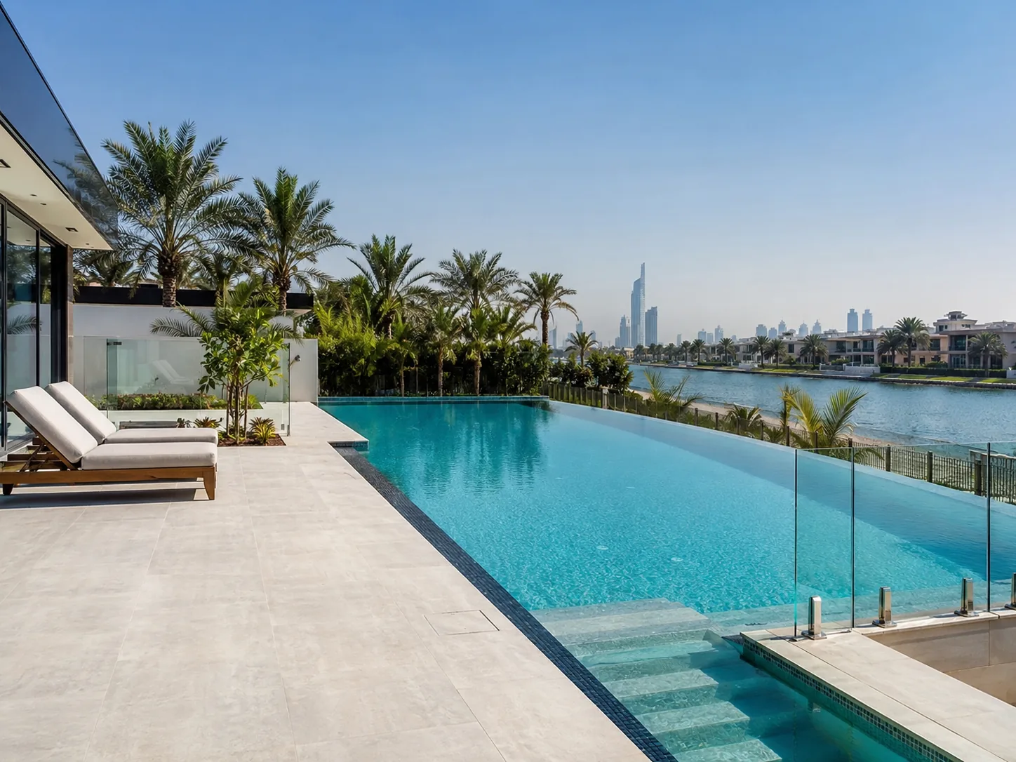 Modern infinity pool beside a Dubai waterfront villa